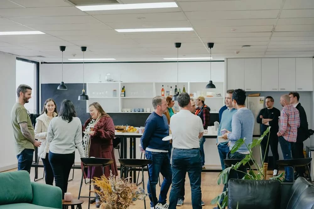 People talking at a small professional networking event